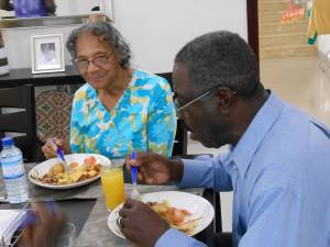 enjoying-dinner_black-eye-peas-yams-chicken-w-gravy-homemade-corn-bread-jan320144